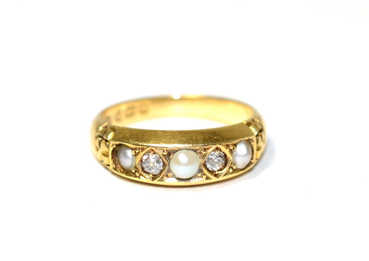 Lot 258 - An 18 carat gold pearl and diamond ring, three pearls spaced by old cut diamonds in kite...