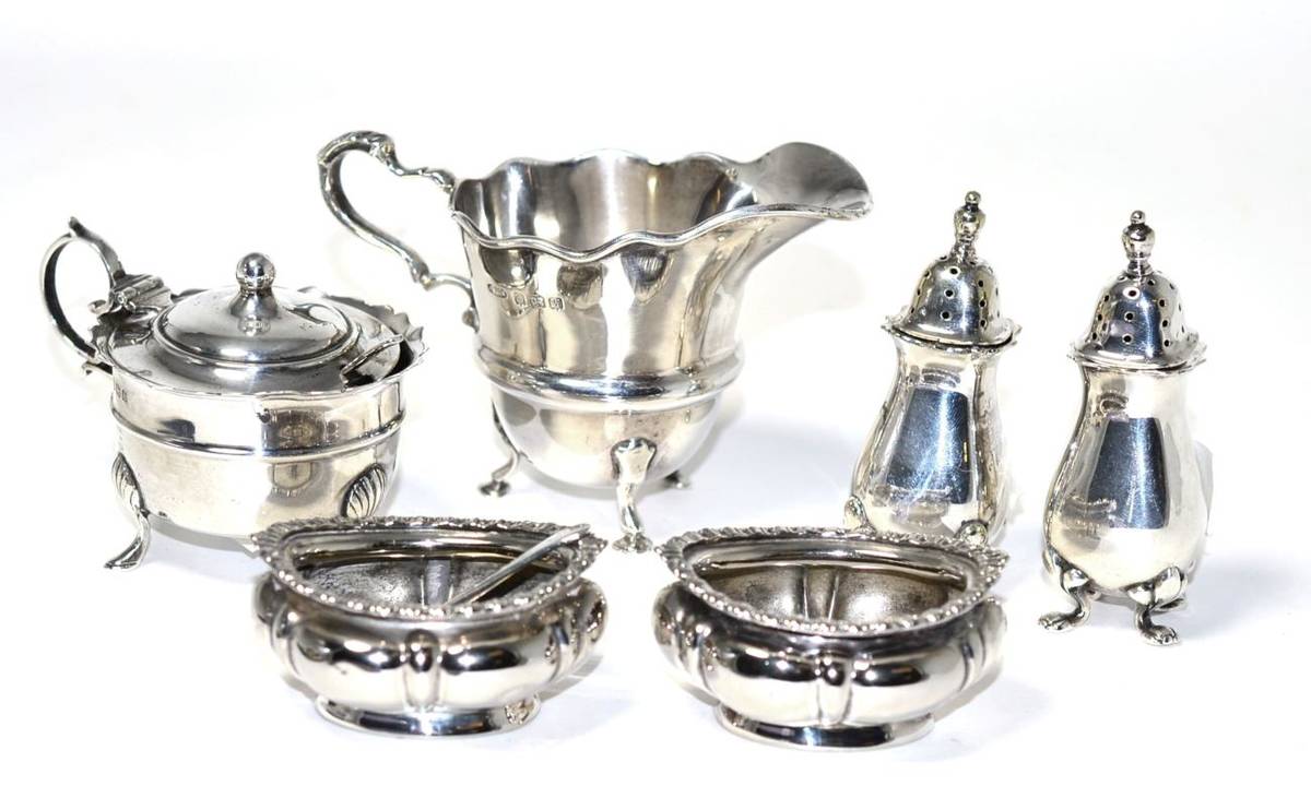 Lot 261 - A pair of silver salts, a pair of silver pepperettes, a silver mustard and a cream jug, various...