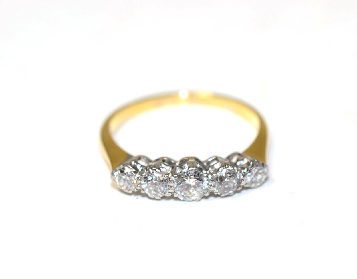 Lot 264 - A diamond five stone ring, graduated transitional cut diamonds, in claw settings, to knife edge...