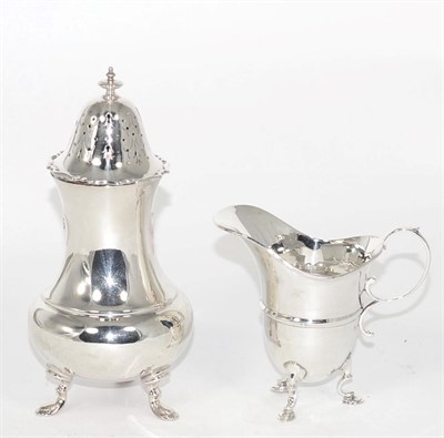 Lot 271 - Silver caster hall marked Sheffield; together with a silver helmet cream jug (2)