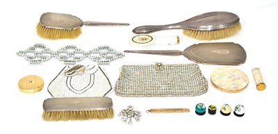 Lot 284 - A silver backed mirror and three brushes with a Stratton compact and lipstick with other items...