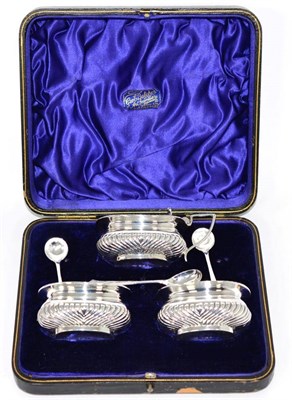 Lot 285 - A late Victorian silver three piece condiment set, Mark Willis, Sheffield 1897, part fluted,...