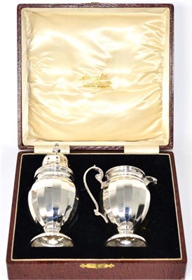 Lot 286 - A boxed silver sugar caster and cream jug set, Birmingham, 1927, W.N. Ltd  (2)