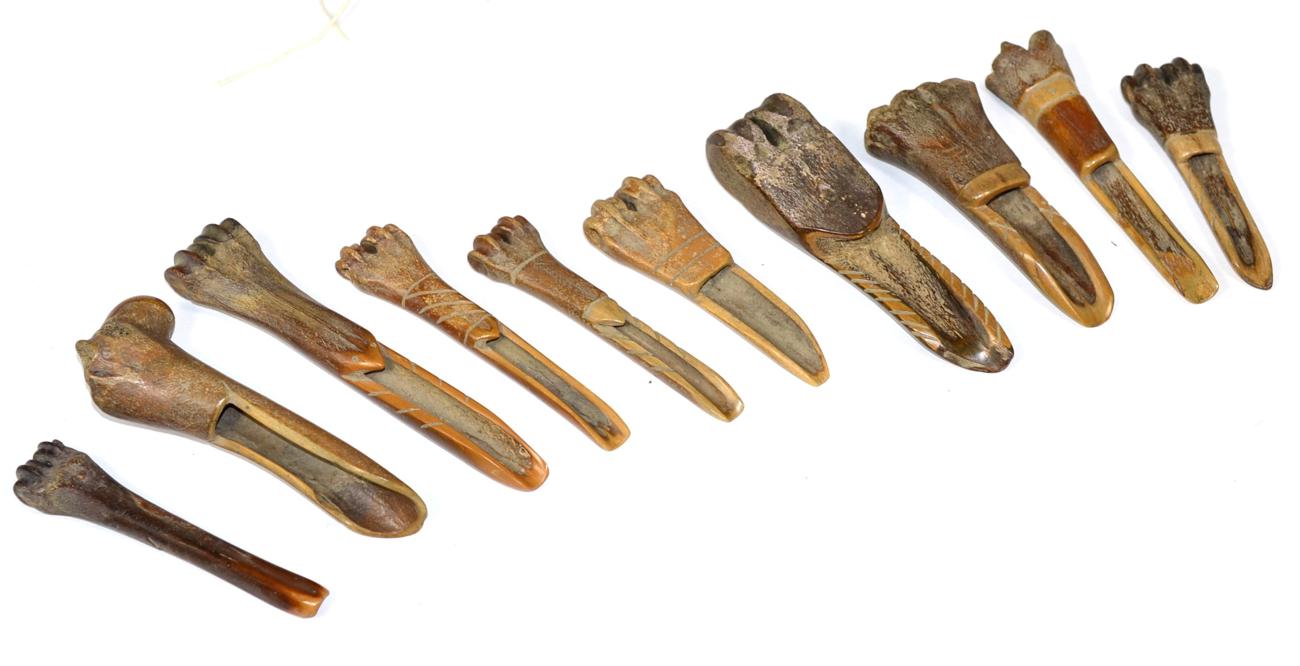 Lot 290 - A group of 16th/17th century carved bone marrow scoops in a leather case