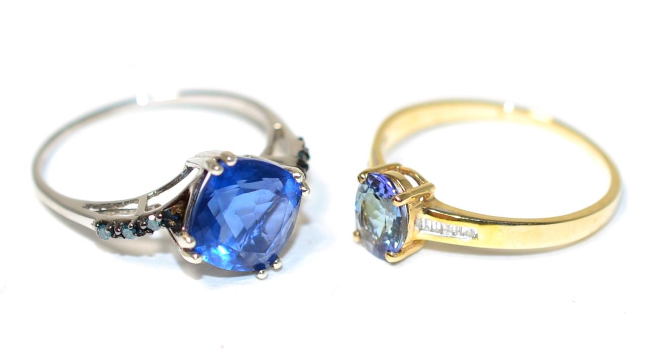 Lot 362 - A 9 carat gold bi-colour tanzanite and diamond ring, an oval cut tanzanite in a claw setting,...