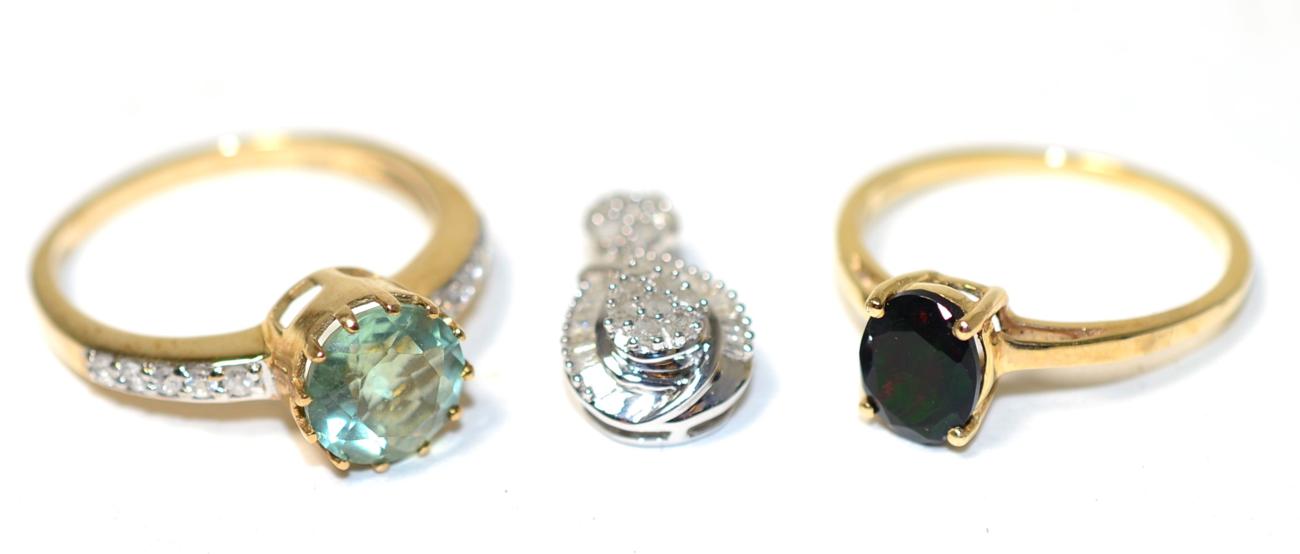 Lot 363 - A 9 carat gold fluorite and white zircon ring, a round cut fluorite in a claw setting, to ziron set