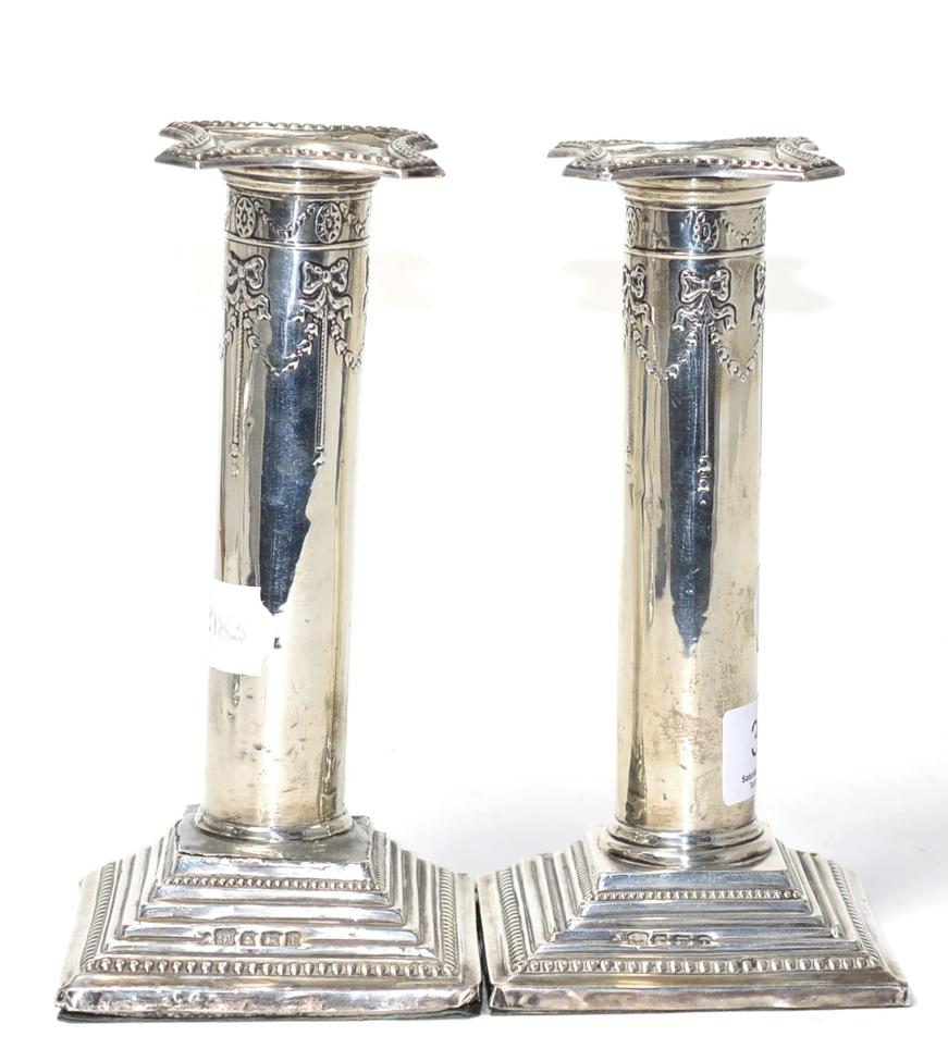 Lot 370 - A pair of silver candlesticks, Birmingham, weighted bases (a.f.) (2)