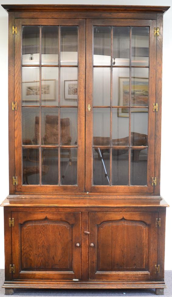 Lot 1006 A Reproduction Oak Bookcase, with a bold