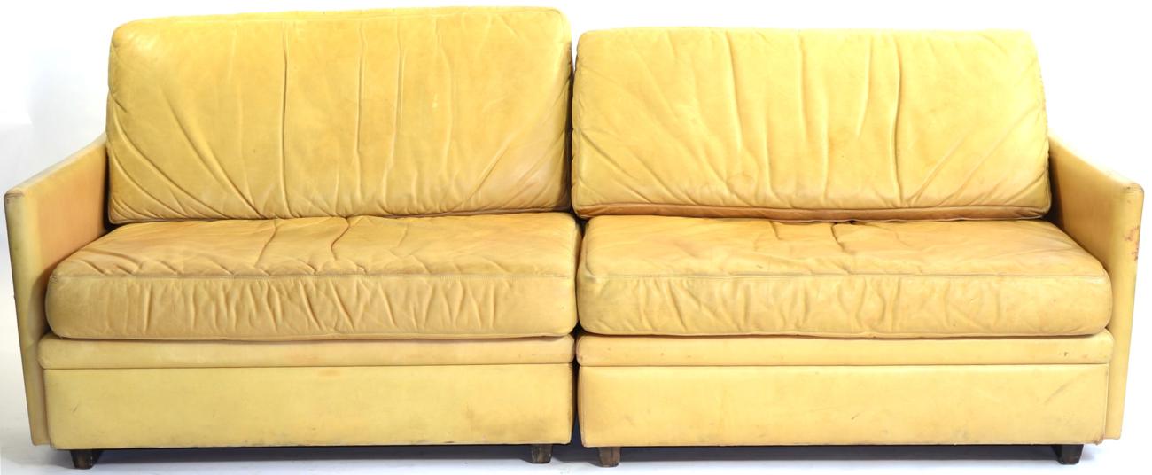 Lot 1118 - A 1970s Danish Dux Light Tan Leather Sofa, in two sections, with rounded back support and squab...