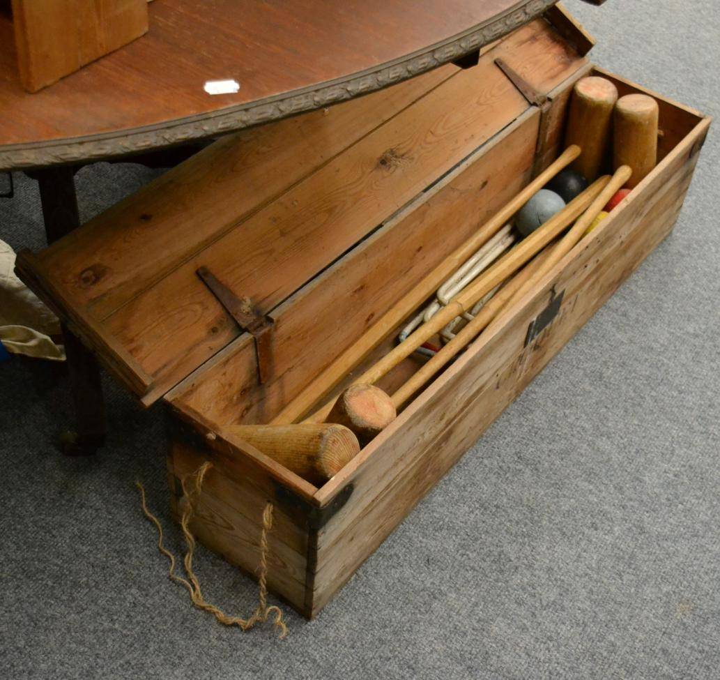 Lot 1224 - A wooden cased croquet set