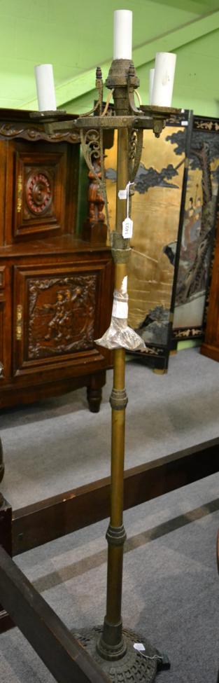Lot 1493 - A bronze standard lamp, circa 1900, with scroll supports, knopped column and circular base,...