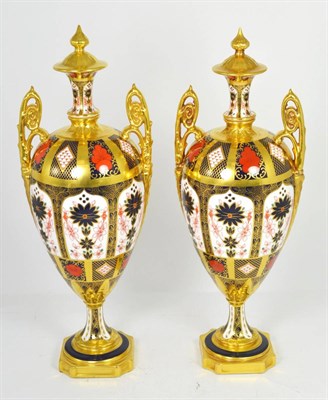 Lot 1 - A pair of Royal Crown Derby Old Imari twin handled vases and covers, pattern 1128, 42cm
