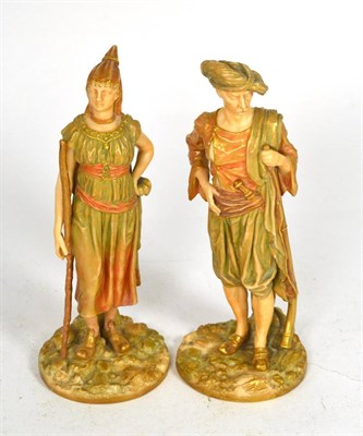 Lot 25 - A pair of Royal Worcester figures modelled as Bringaree Indians, puce printed marks to base...