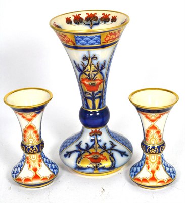 Lot 63 - A pair of Moorcroft Macintyre vases and a matching larger exanple