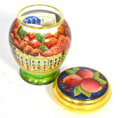 Lot 65 - A Moorcroft enamel Pomegranate pattern trinket box together with a Moorcroft enamel vase...