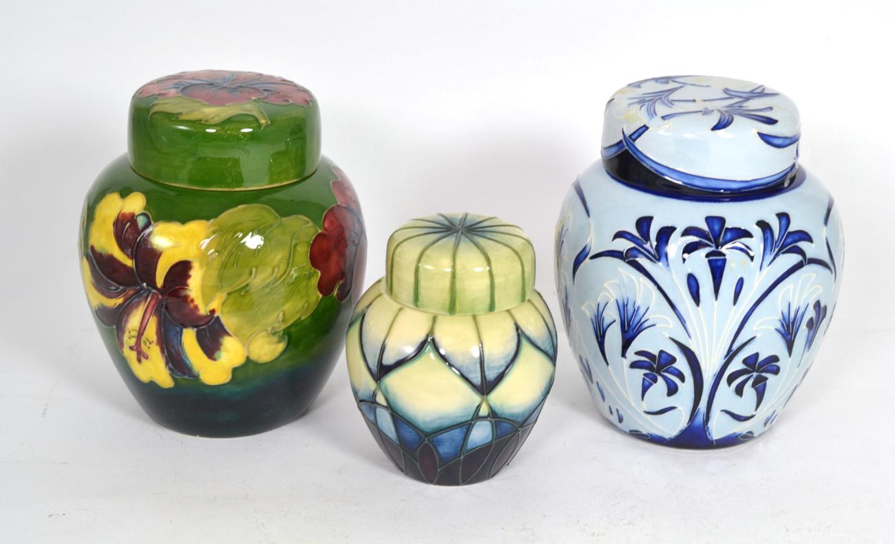 Lot 71 - Three Moorcroft ginger jars, Hibiscus, 15cm, Midsummer Surprise by Philip Gibson, 15cm (second) and