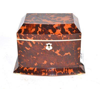 Lot 84 - A regency tortoiseshell tea caddy, of bowfront form, the hinged cover containing two lidded...