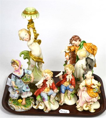 Lot 111 - Five Capodimonte figures together with a similar candlestick