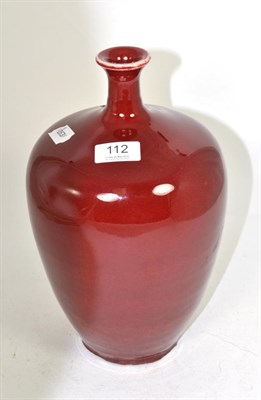 Lot 112 - A Chinese sang de boeuf bottle vase, 30cm high