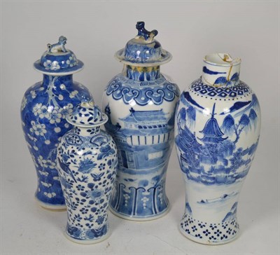 Lot 126 - A Chinese porcelain blue and white vase and cover decorated with buildings and three other...