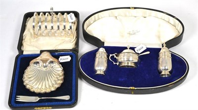 Lot 144 - A Barraclough & Sons of Leeds silver oyster dish and fork, a silver six division toast rack and...