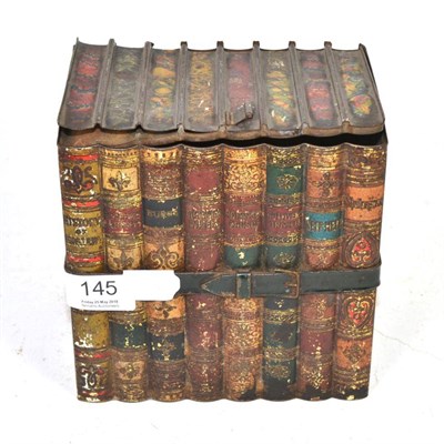 Lot 145 - A tole ware biscuit tin in the form of a stack of books