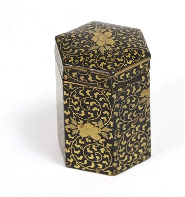 Lot 157 - A Japanese lacquered papier mâché hexagonal box and cover, 19th century, gilt with scrolling...