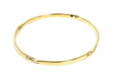 Lot 164 - A 9 carat gold twist motif bangle, measures 6.5cm in diameter