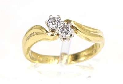 Lot 206 - An 18 carat gold diamond two stone ring, round brilliant cut diamonds in claw settings, to...