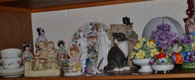 Lot 237 - A shelf of ceramic including; a Karl Enz figure of a baby, a masons vase, Kaiser vase, floral...