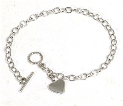 Lot 264 - A 9 carat white gold bracelet, with heart charm and toggle clasp, length 19cm