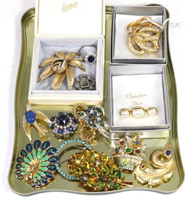 Lot 268 - Three Christian Dior gilt metal brooches, one as a textured paste set triple hoop, measures...