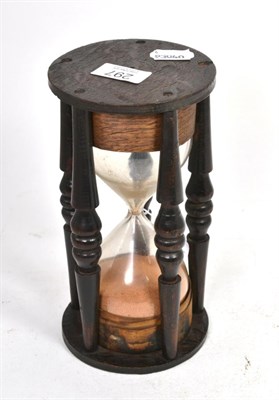 Lot 297 - An early 19th century treen turned hour glass, 22cm high