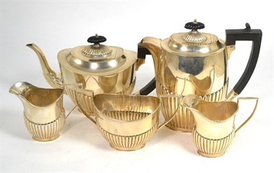 Lot 314 - A Georgian style silver five piece tea set, by J S & S, Sheffield 1931, comprising a tea pot, water