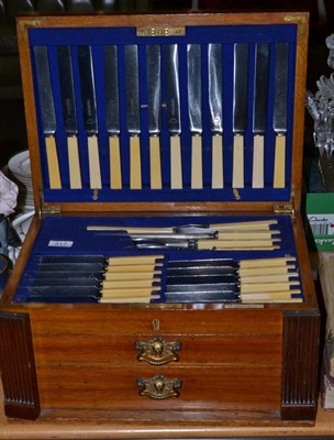 Lot 317 - An oak cased canteen of plated flatware