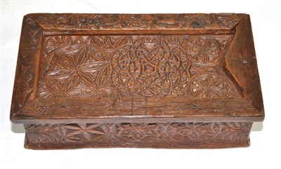 Lot 321 - A late 17th/early 18th century carved box, with sliding lid, 23cm