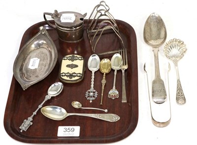 Lot 359 - A selection of silver items comprising a bob bon dish; a toastrack; a salt with blue glass liner; a