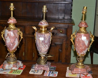 Lot 361 - A pair of marble and ormolu mounted vase lamps and another single example (3)