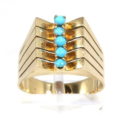 Lot 375 - A turquoise ring, five round cabochon turquoise to an angular split shank, finger size N1/2