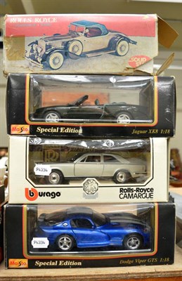 Lot 1042 - A group of four Burago and other model cars