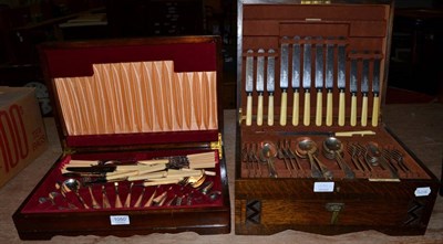 Lot 1050 - A Joseph Rogers & Sons, Sheffield oak cased canteen of flatware together with another canteen...