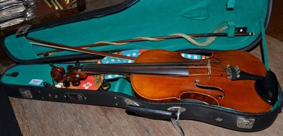 Lot 1051 - A cased violin and two bows