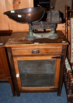 Lot 1082 - A set of old shop scales and a larder cupboard