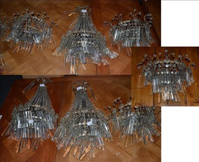 Lot 1097 - Set of three early 20th century cut glass wall lights with faceted drop lustres, 66cm high; and...