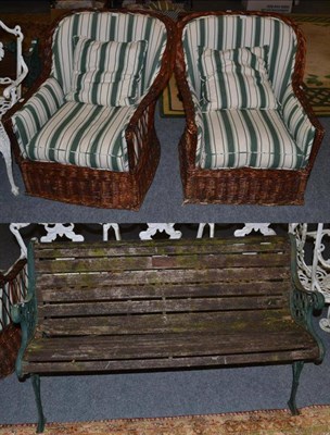 Lot 1103 - A Victorian green painted cast iron and wooden slatted garden bench; together with a pair of wicker