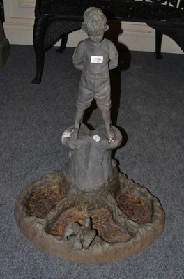 Lot 1106 - A lead figural bird bath, modelled as a boy stood on a tree trunk