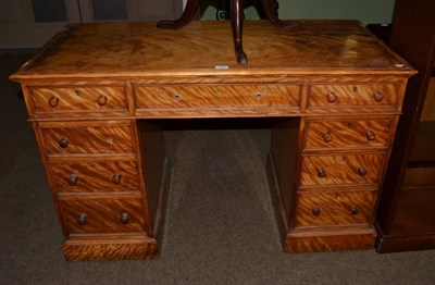 Lot 1111 - A Victorian satinwood double pedestal desk, circa 1870, with three frieze drawers, one pedestal...