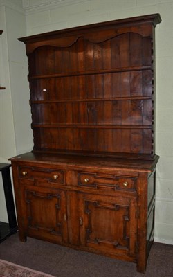 Lot 1118 - A 20th century carved oak dresser and rack