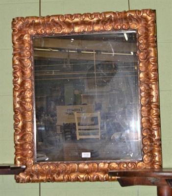 Lot 1132 - A gilt and gesso rectangular framed wall mirror