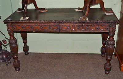 Lot 1133 - A Victorian carved oak table